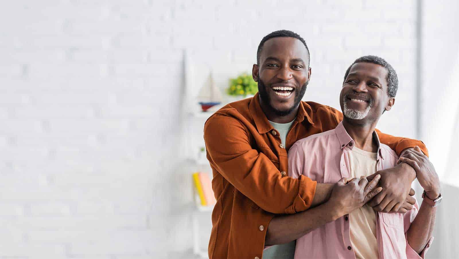 a man hugging another man