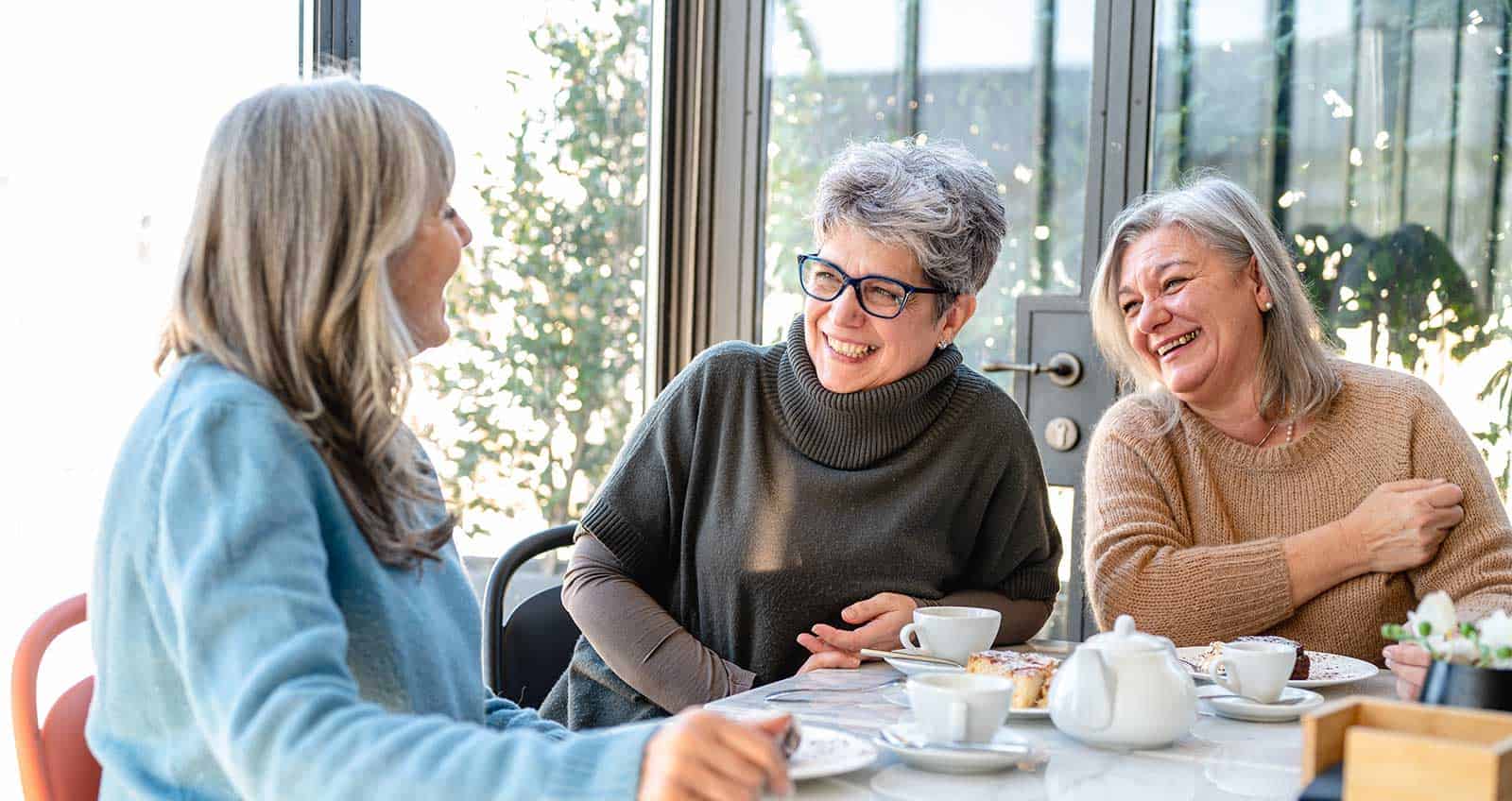 a group of women sitting at a table