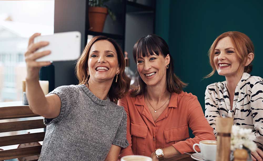 three women posing for a photo - Marion Dental Implants