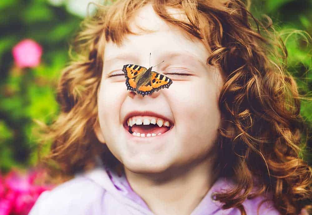 child with butterfly on her nose - Marion Pediatric Dentist