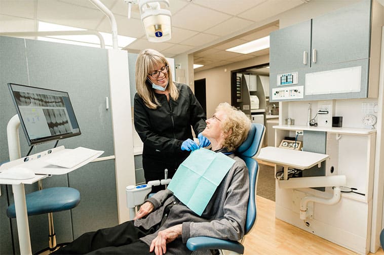 a woman in a dentist's chair