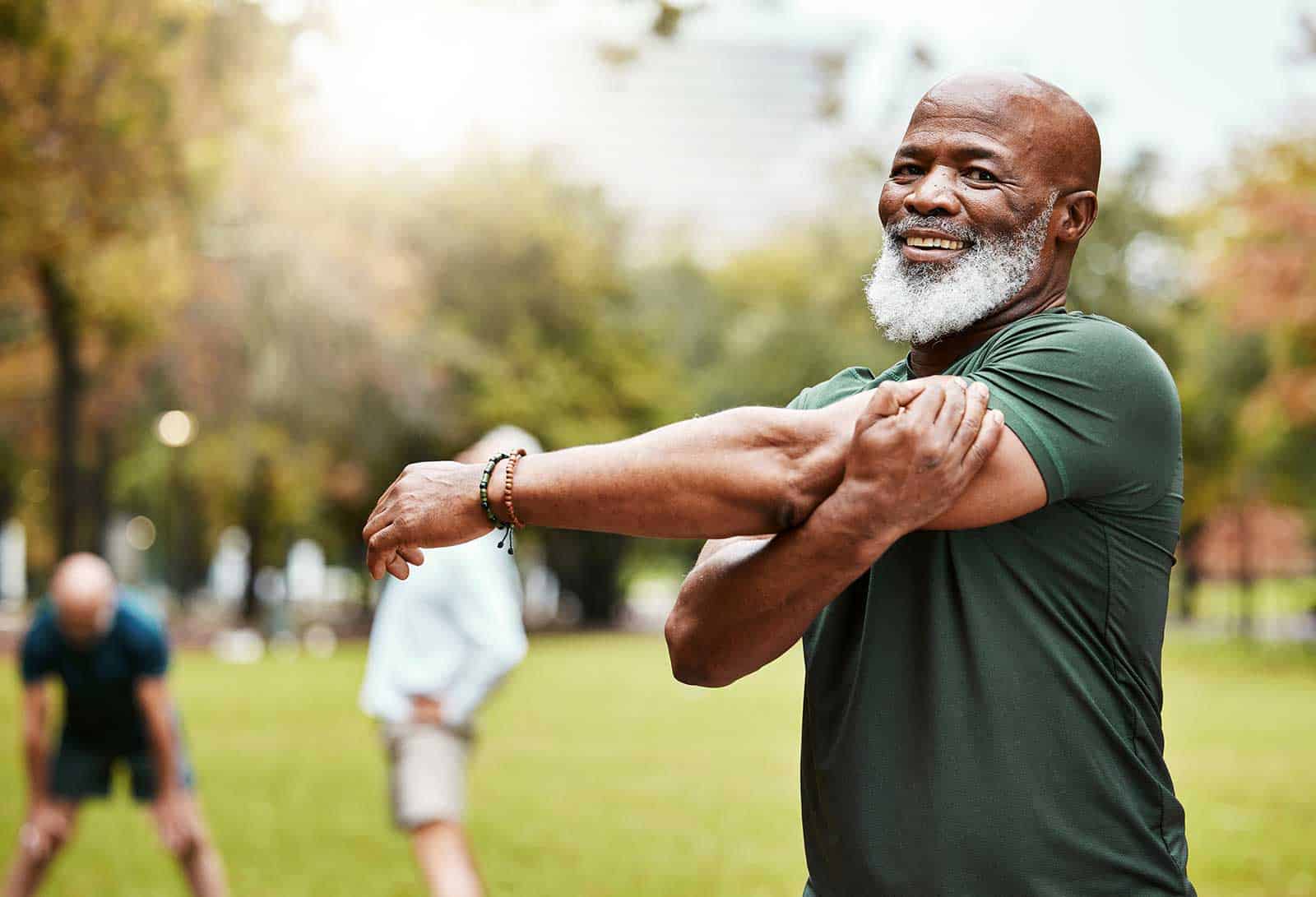 a man stretching his arms