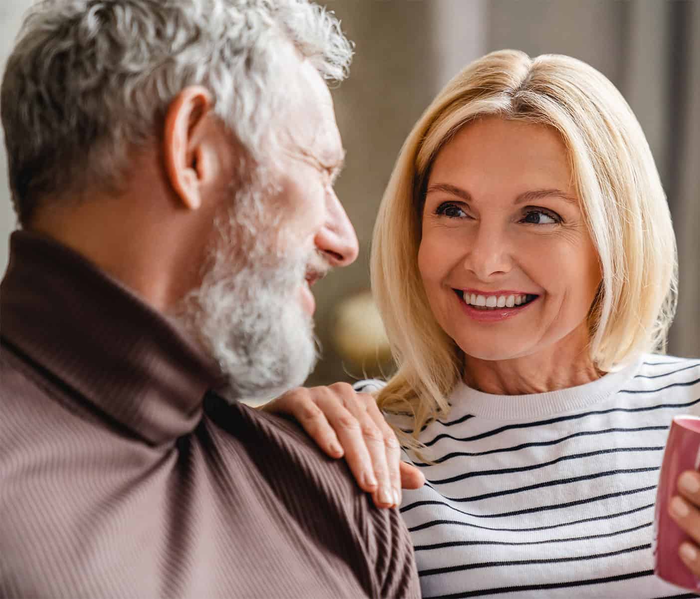 a man and woman looking at each other