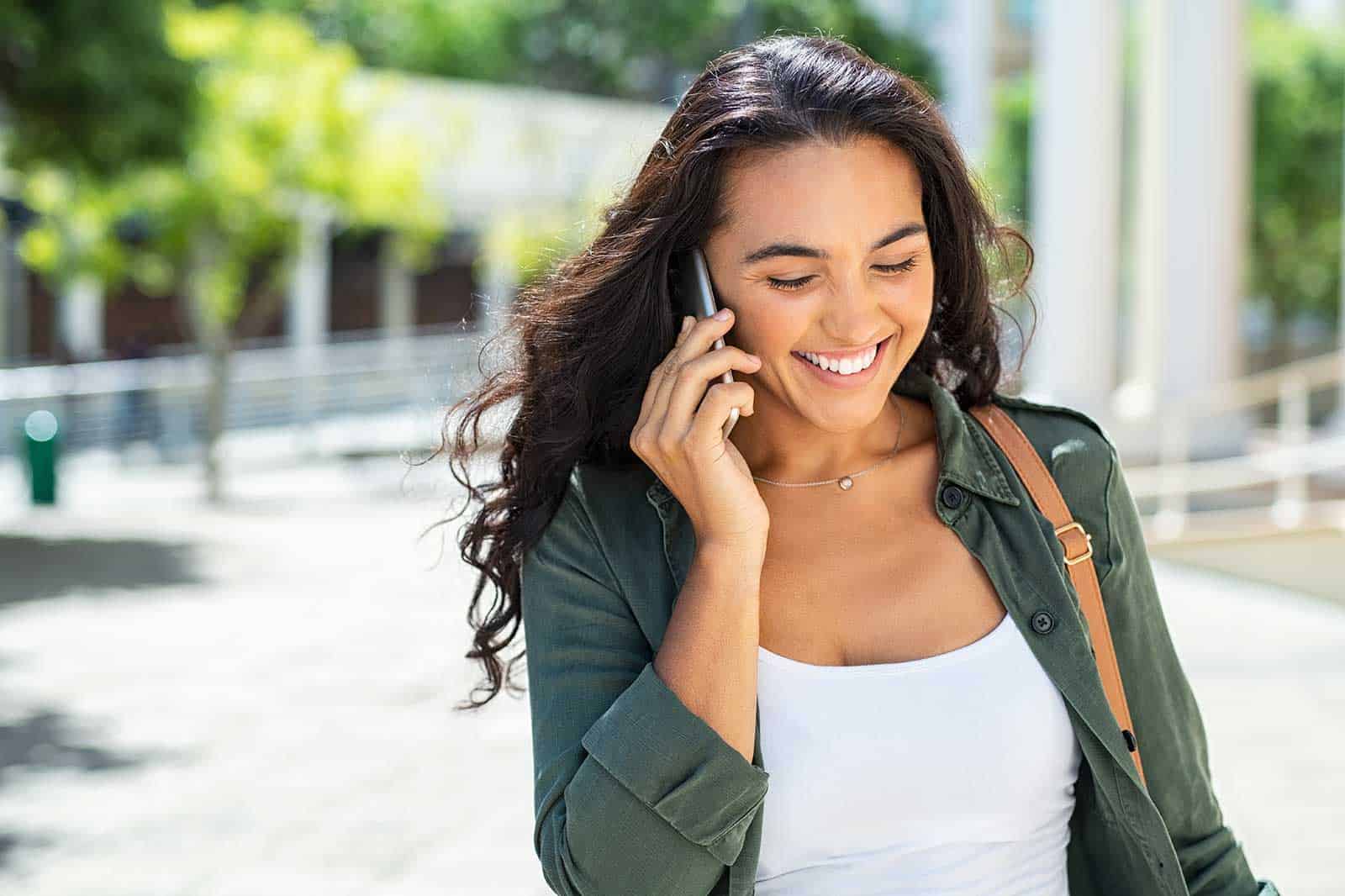 woman talking on a phone - Marion Dental Practice